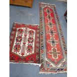 A RED GROUND AFGHAN TYPE RUNNER