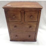 A NAIVELY MADE 19TH CENTURY OAK MINIATURE CHEST OF DRAWERS