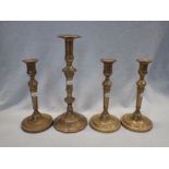 FOUR BRASS CANDLESTICKS