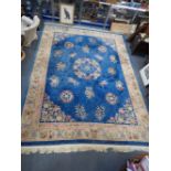 A LARGE BLUE GROUND ASIAN RUG