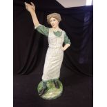 A EARLY 20TH CENTURY POTTERY SHOP DISPLAY FIGURE