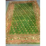 A GREEN GROUND RUG