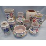 A COLLECTION OF POOLE POTTERY VASES AND JUGS