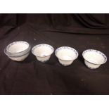 A SET OF FOUR BLUE AND WHITE CHINESE TEA BOWLS