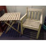 A WEATHERED TEAK GARDEN SEAT