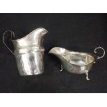 A GEORGE III SILVER MILK JUG, AND A SAUCEBOAT