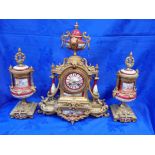 A FRENCH GILT SPELTER AND PORCELAIN CLOCK GARNITURE