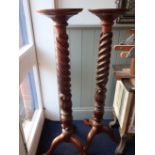 A PAIR OF CARVED AND SPIRAL-TURNED MAHOGANY TORCHERES