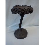 A BRONZE TABLE CENTREPIECE/STAND