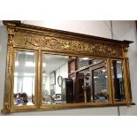 A REPRODUCTION REGENCY STYLE THREE-PLATE OVERMANTEL MIRROR