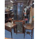 A BOW FRONTED CORNER DISPLAY CABINET