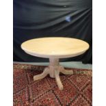 A LIGHT OAK CENTRE TABLE