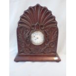 AN EARLY 20TH CENTURY CARVED MAHOGANY CASED CLOCK