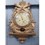 A SWEDISH EMPIRE STYLE CARTEL CLOCK, IN CARVED GILTWOOD CASE