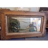 AN EDWARDIAN WALL MIRROR