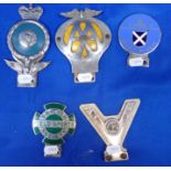 A COLLECTION OF CAR BADGES