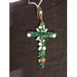 A GLASS AND PASTE ENCRUSTED CROSS PENDANT