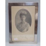 A SIGNED PHOTOGRAPH OF QUEEN MARY, DATED 1921, IN A PLAIN SILVER FRAME