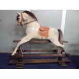 A 'SAFETY' ROCKING HORSE, POSSIBLY BY W. WILSON & SONS (SILVER CROSS) CIRCA 1920