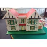 A VINTAGE TRIANG STYLE DOLLS HOUSE, WITH GARAGE