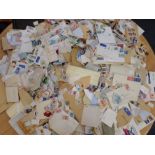 A QUANTITY OF UNSORTED STAMPS