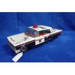 A JAPANESE TINPLATE TOY POLICE CAR