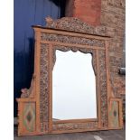 A LARGE ASIAN CARVED FRAME, WITH BEASTS AND SCROLLING BORDERS