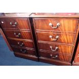 A PAIR OF REPRODUCTION TWO-DRAWER MAHOGANY FILING CABINETS