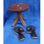 AN AFRICAN TRIBAL STYLE FOUR LEGGED STOOL