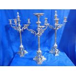 A PAIR OF IMPRESSIVE VICTORIAN SILVER-PLATED CANDELABRA AND MATCHING CENTREPIECE