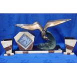 AN ART DECO CLOCK GARNITURE WITH BRONZED SPELTER SEAGULL AFTER IRENE ROCHARD