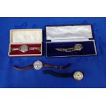 FOUR GOLD CASED WATCHES