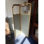 A LOUIS XV STYLE MOULDED AND GILT THREE-PANEL FOLDING SCREEN