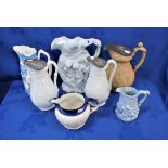 A COLLECTION OF 19TH CENTURY RELIEF-MOULDED JUGS