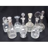 A COLLECTION OF GLASS DECANTERS