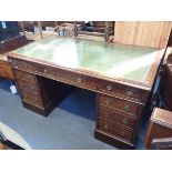 A GEORGE III STYLE MAHOGANY PEDESTAL DESK