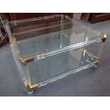 A 1980s POST-MODERN STYLE PERSPEX FRAMED COFFEE TABLE