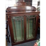 A WILLIAM IV MAHOGANY BOOKCASE WITH CARVED BACKSTAND