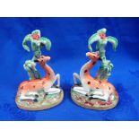 A PAIR OF EARLY VICTORIAN STAFFORDSHIRE GIRAFFES