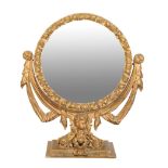 A GILTWOOD AND COMPOSITION DRESSING MIRROR