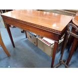 A GEORGE III MAHOGANY TEA TABLE