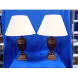 A PAIR OF HARDWOOD URN TABLE LAMPS