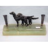 TWO BRONZE SETTERS ON AN ONYX PEN STAND