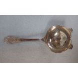 A SILVER TEA STRAINER