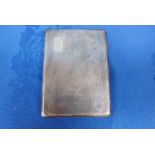 AN ENGINE TURNED SILVER CIGARETTE CASE