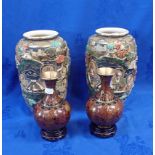 A PAIR OF ORIENTAL CLOISONNE VASES ON WOODEN STANDS