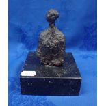 A STYLISED CAST BRONZE FIGURE ON A MARBLE BASE