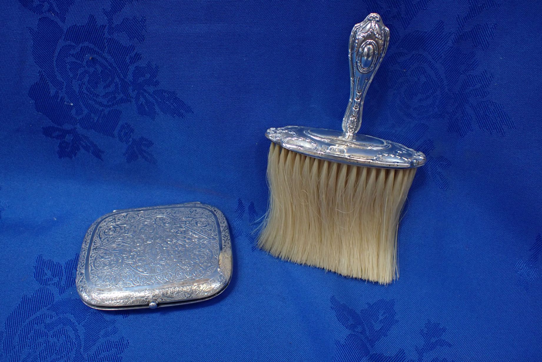 A SILVER HANDLED TABLE BRUSH