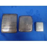 TWO SILVER CIGARETTE CASES AND A WHITE METAL VESTA CASE