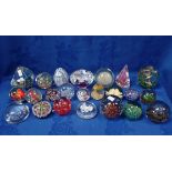 A COLLECTION OF GLASS PAPERWEIGHTS